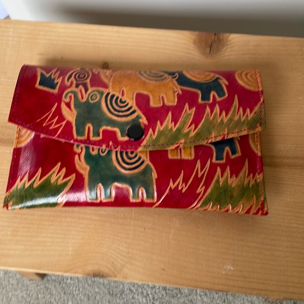 Leather clutch purse with matching wallet and change purse.